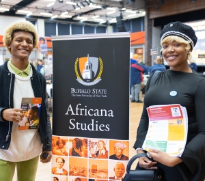 Students with a Africana Studies banner