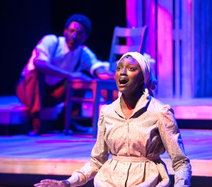 Actor singing onstage